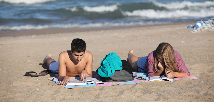 Picture of students hanging out on the beach