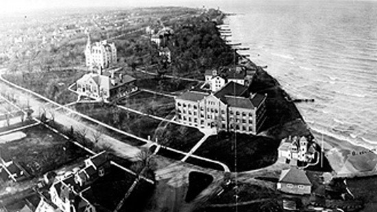 1907 - At the turn of the century, the open spaces and oak groves were more prominent than its buildings, pictured from right to left: the Life Saving Station, Fisk Hall and the Hall of Science.