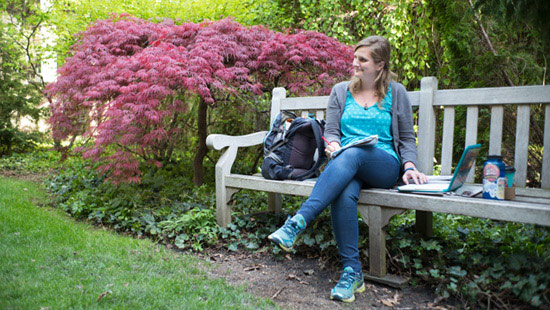 Picture of Stephanie sitting on a bench at Northwestern